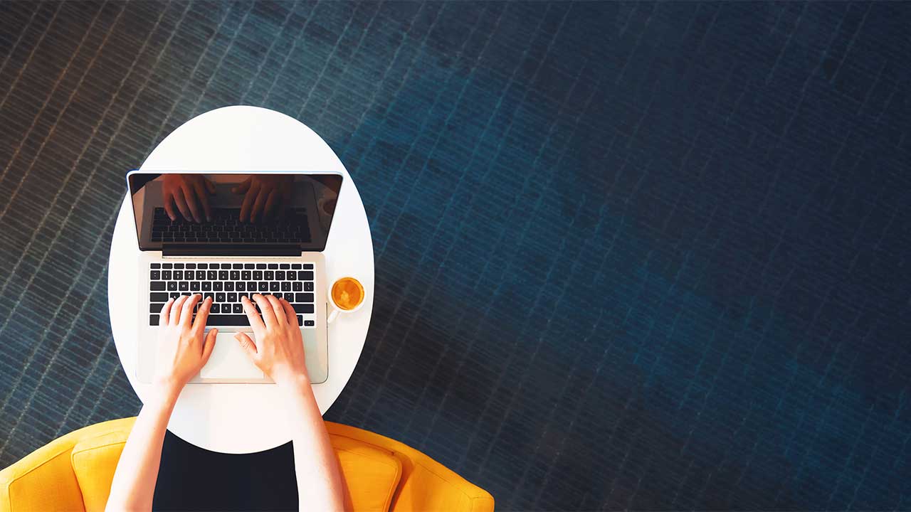 Aerial view of woman on laptop