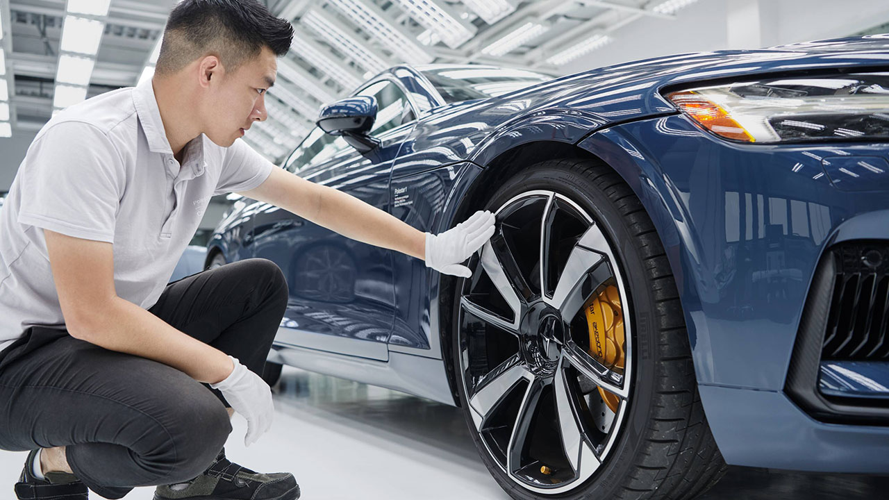 polestar mechanic checking disc brakes