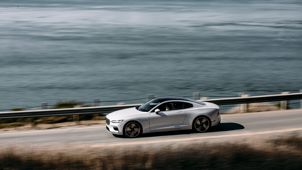 White Polestar 1 driving near oceanside